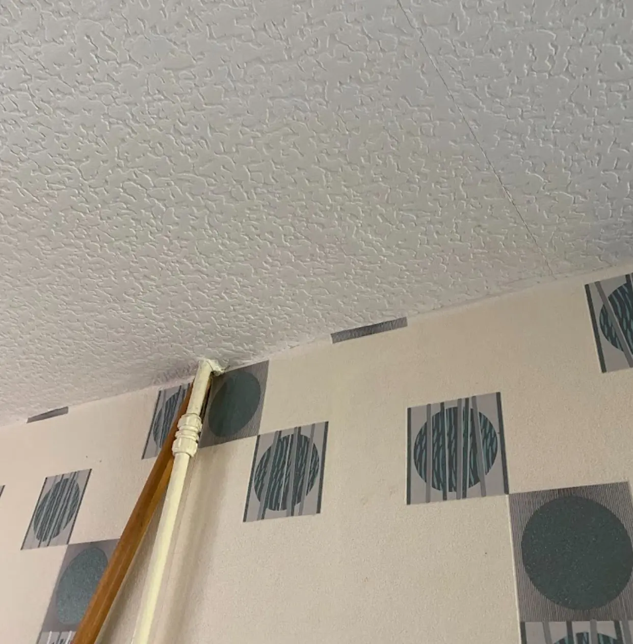 Close view of textured ceiling coating before asbestos removal in London