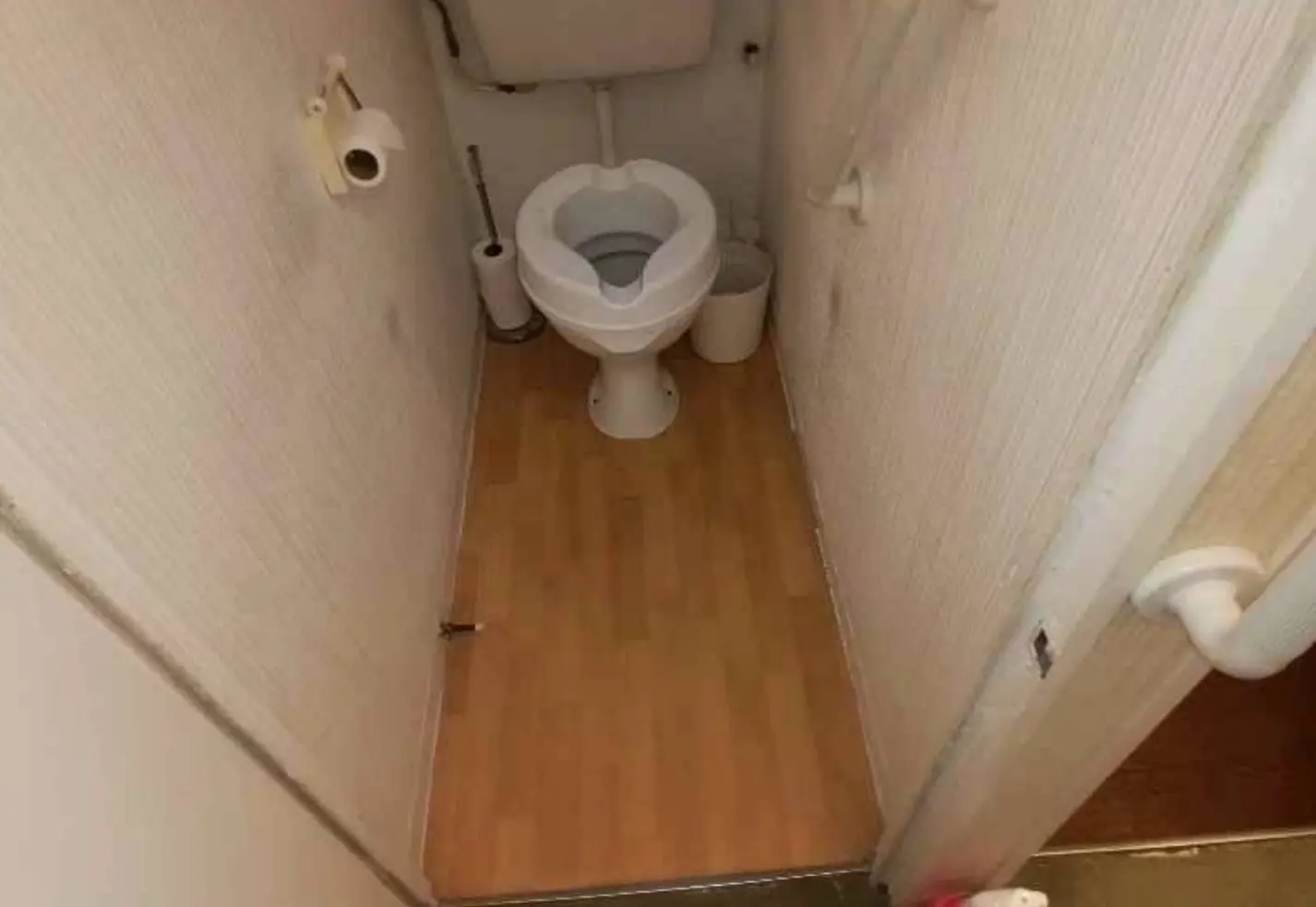 Asbestos floor covering and removal area in a London property