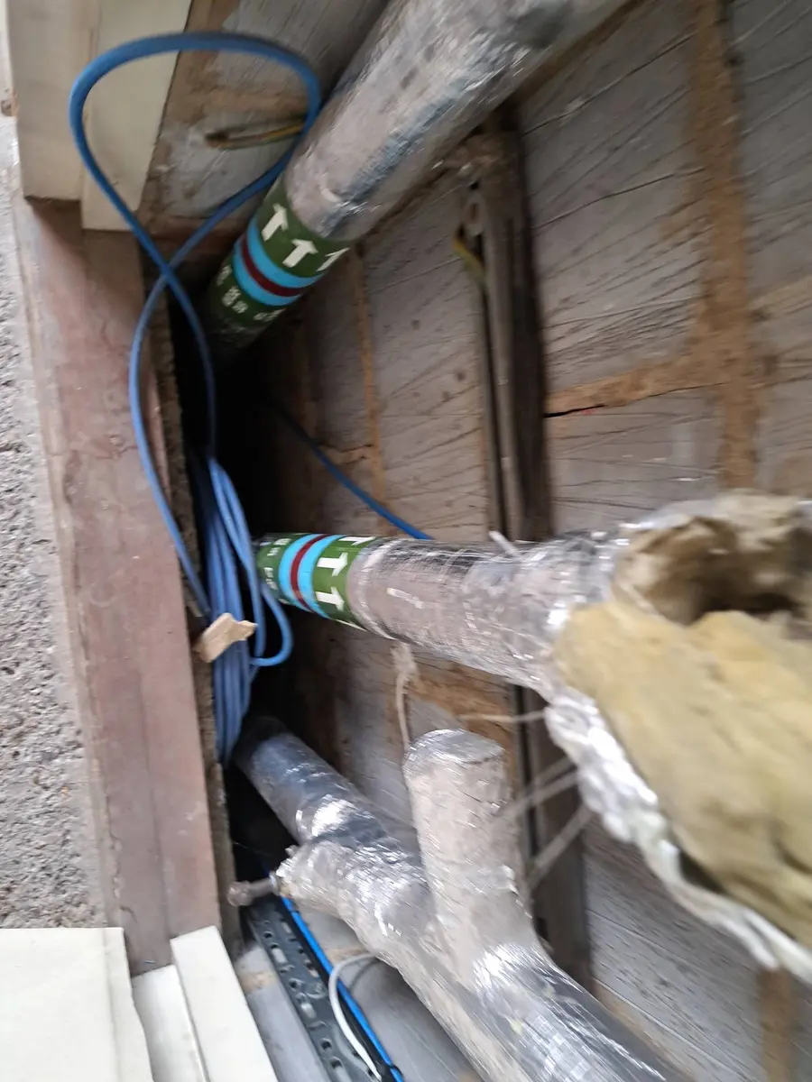 Wrapped service pipework for asbestos pipe insulation assessment London, Clapham SW4
